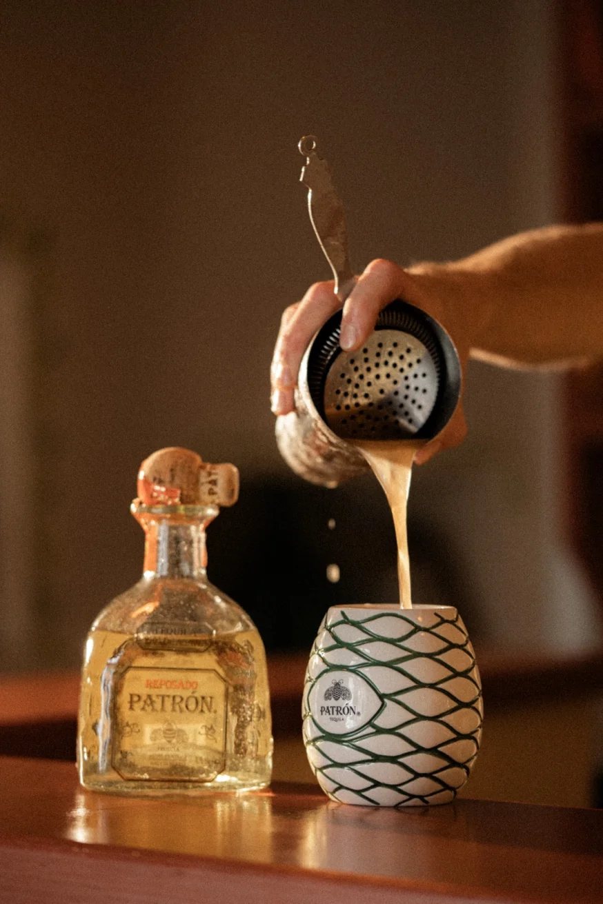 Bartender pouring a classic Patrón margarita at Pūblico Mezcaleria Mykonos